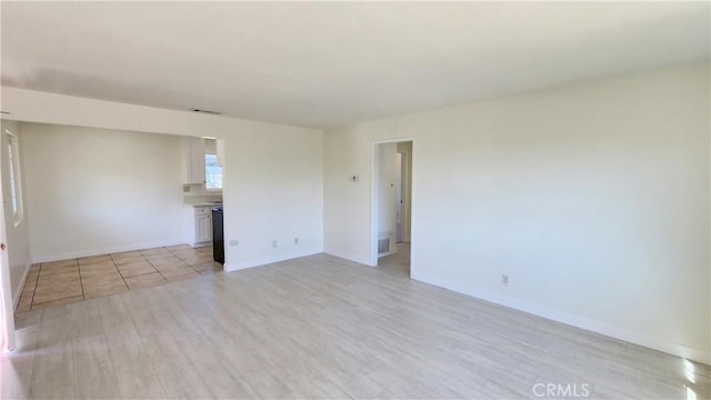 unfurnished room with light hardwood / wood-style flooring