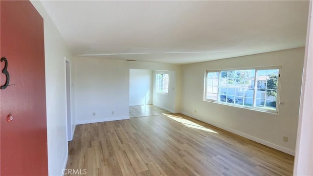 spare room featuring light hardwood / wood-style floors