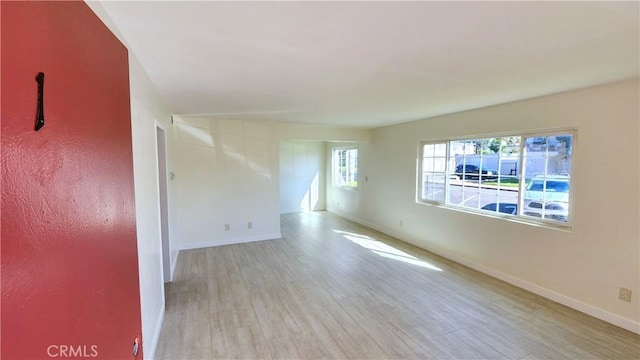 spare room featuring light hardwood / wood-style flooring