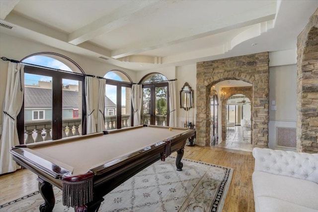 playroom with light hardwood / wood-style floors, french doors, beamed ceiling, and pool table