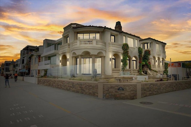 view of front of home with a balcony