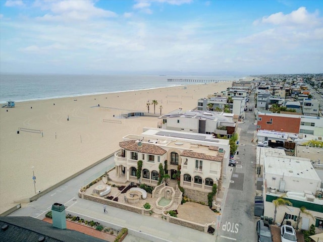 aerial view featuring a water view and a beach view