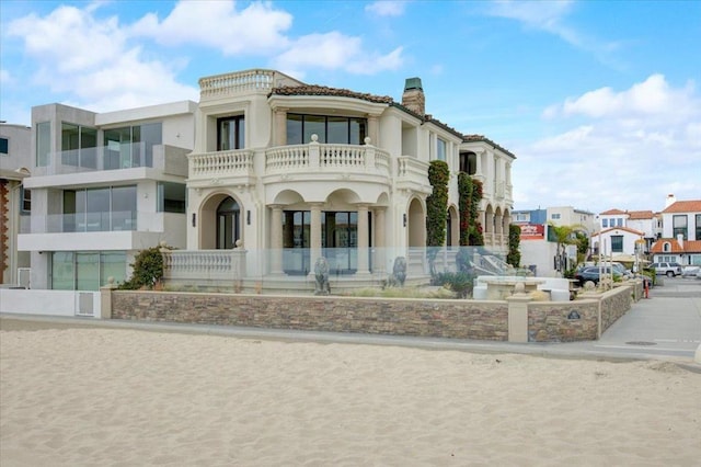 mediterranean / spanish-style house with a balcony