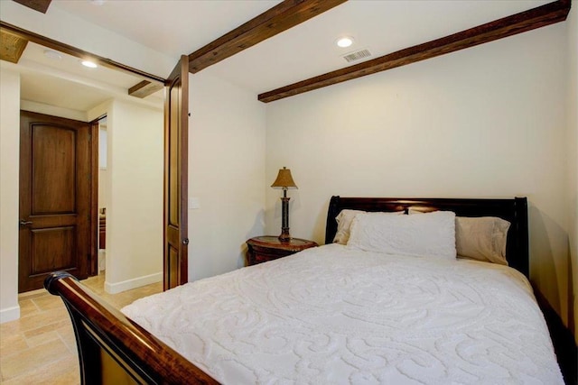 bedroom featuring beamed ceiling