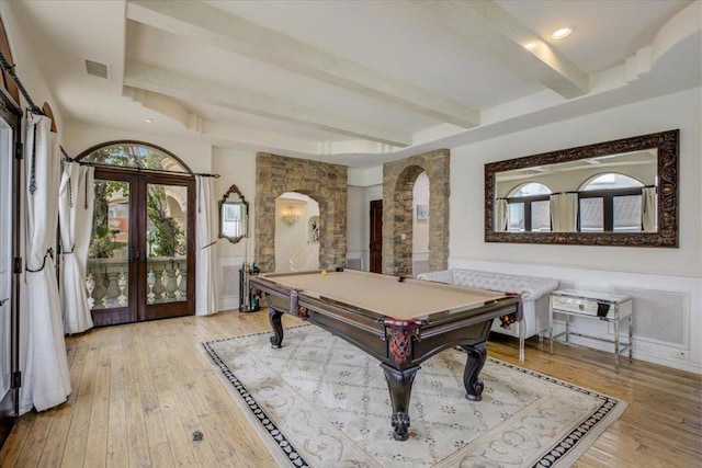 recreation room featuring beam ceiling, french doors, pool table, and light wood-type flooring