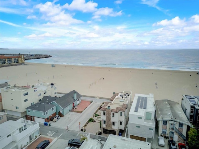 birds eye view of property featuring a water view and a view of the beach