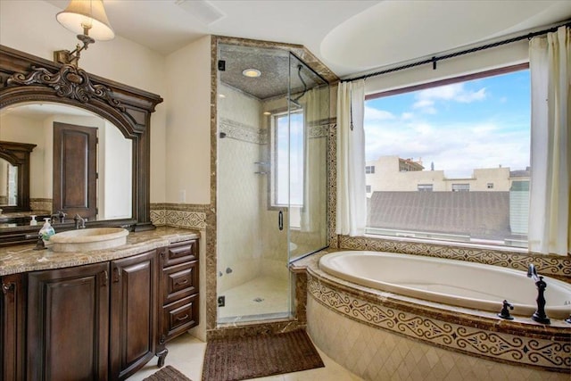 bathroom with vanity, tile patterned floors, independent shower and bath, and plenty of natural light