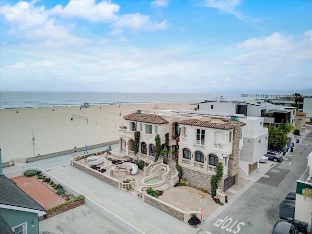 aerial view featuring a water view and a view of the beach