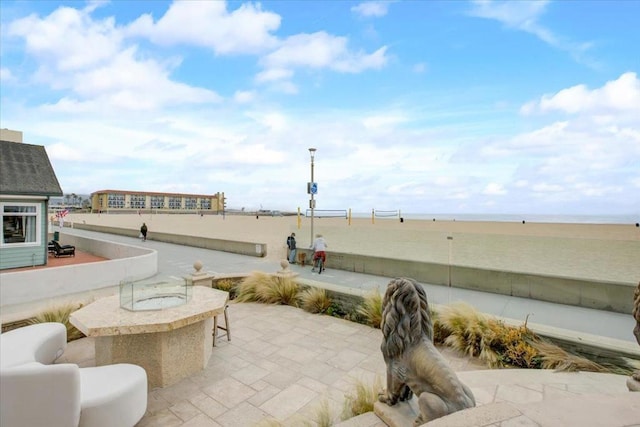 view of patio featuring a water view