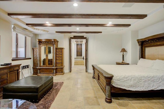 bedroom featuring beam ceiling