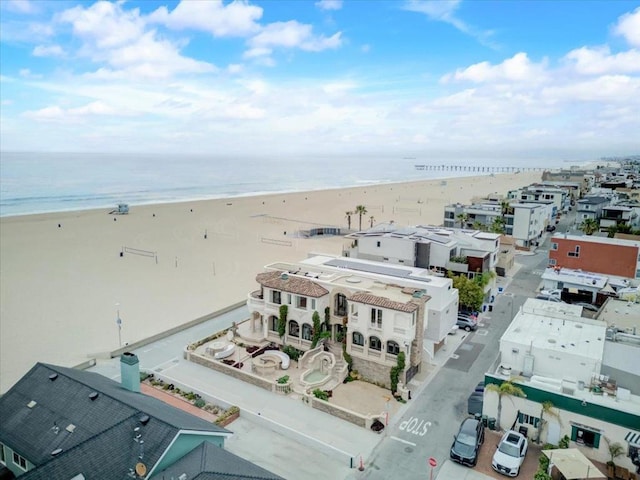 aerial view featuring a view of the beach and a water view