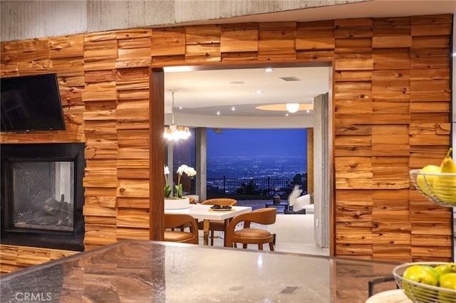 interior space with rustic walls and a multi sided fireplace