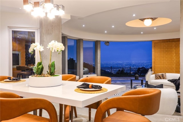 dining area featuring a chandelier and floor to ceiling windows