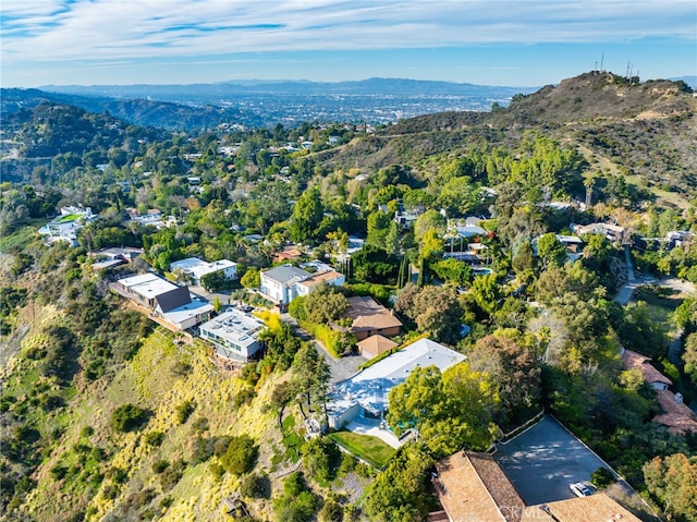 birds eye view of property featuring a mountain view