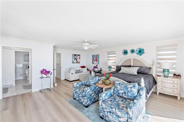 bedroom featuring crown molding, ceiling fan, and light wood-type flooring