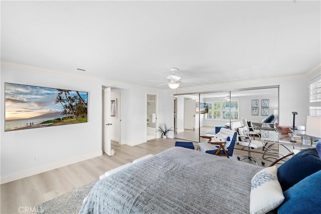 bedroom with ceiling fan, ornamental molding, and light hardwood / wood-style flooring