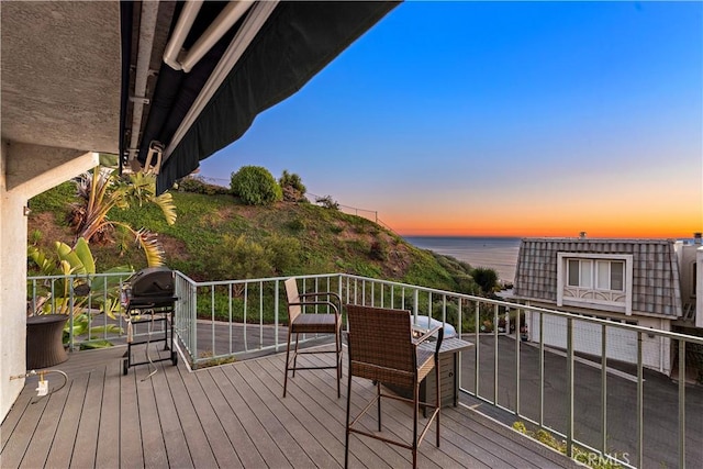 deck at dusk with a water view