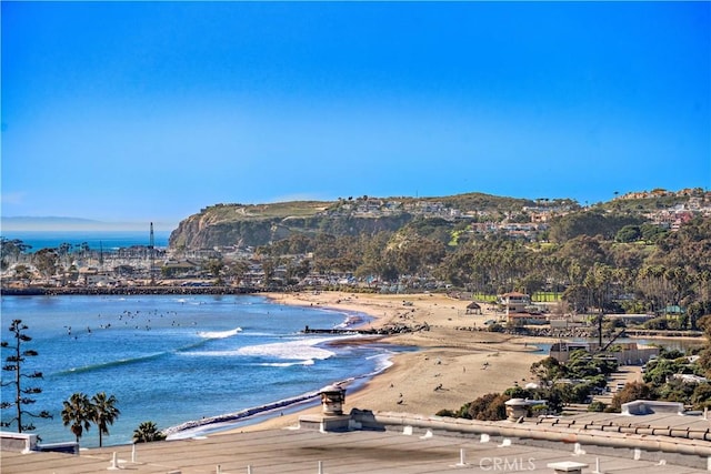 view of water feature featuring a beach view and a mountain view