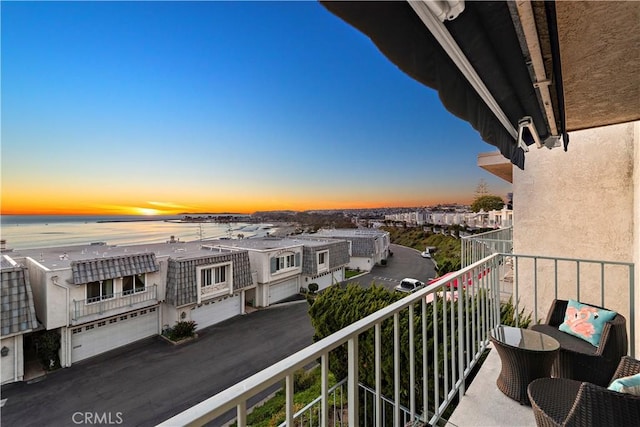 balcony at dusk with a water view