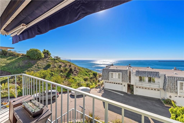 balcony featuring a water view