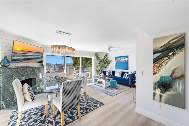 dining space featuring ceiling fan and light hardwood / wood-style floors