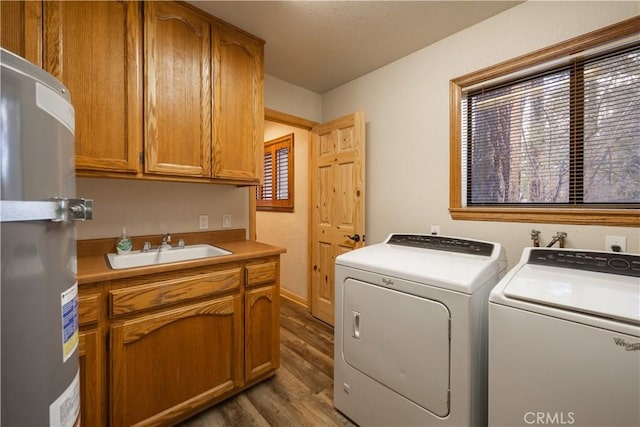 washroom with washer and dryer, sink, dark hardwood / wood-style flooring, and cabinets