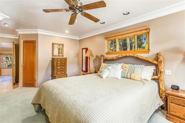 carpeted bedroom with ceiling fan, ornamental molding, and recessed lighting