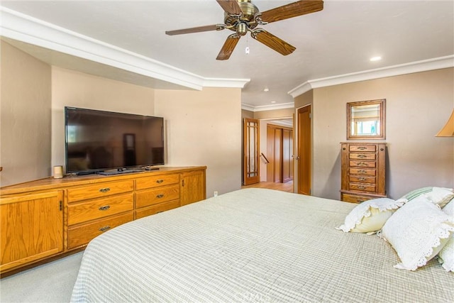 bedroom with recessed lighting, ornamental molding, a ceiling fan, and light colored carpet