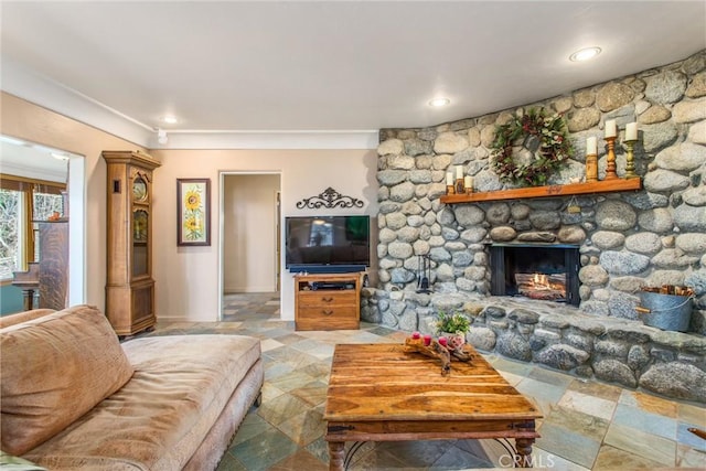 living room with stone finish flooring and a fireplace