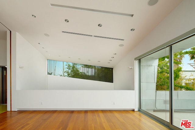 spare room featuring light wood-type flooring