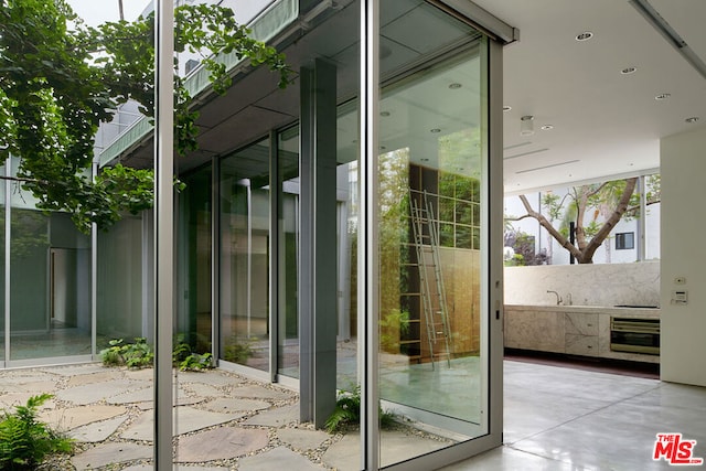 doorway featuring a wall of windows