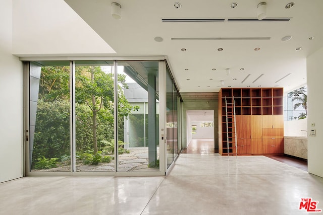 doorway with floor to ceiling windows