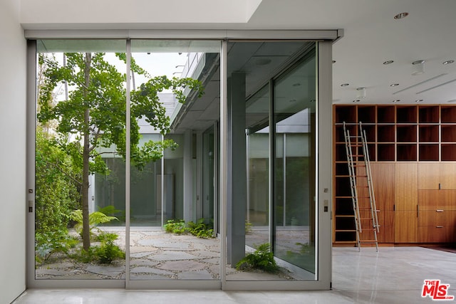 doorway to outside with expansive windows