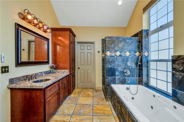 bathroom with separate shower and tub, a wealth of natural light, and lofted ceiling