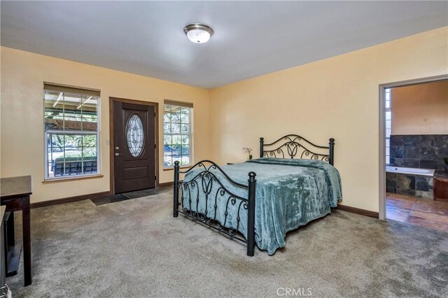 carpeted bedroom with connected bathroom