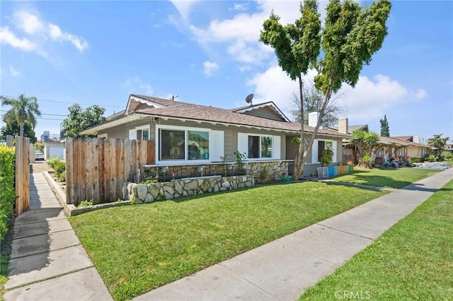 view of front of home with a front lawn