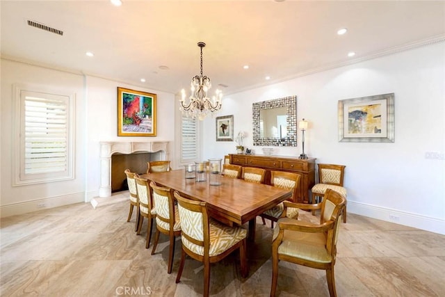 dining space with ornamental molding and a notable chandelier