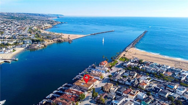 drone / aerial view with a view of the beach and a water view