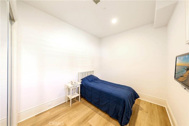 bedroom with light hardwood / wood-style floors