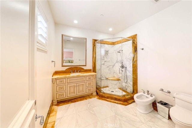 bathroom with an enclosed shower, vanity, toilet, and a bidet