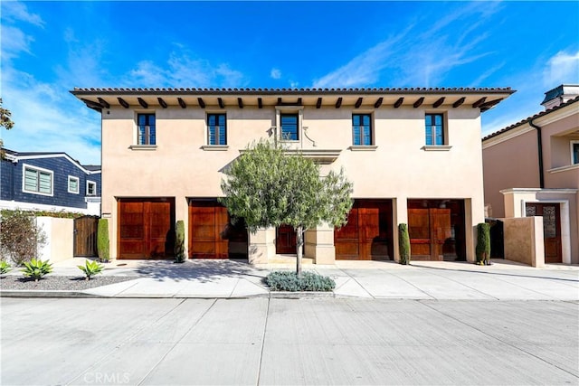 mediterranean / spanish-style home featuring a garage