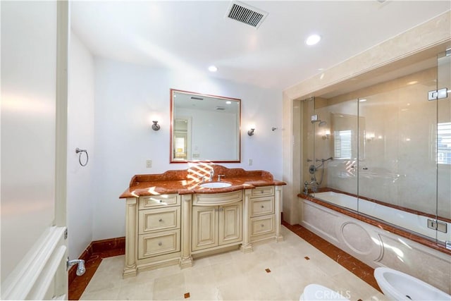 bathroom with tile patterned flooring, vanity, a bidet, and enclosed tub / shower combo