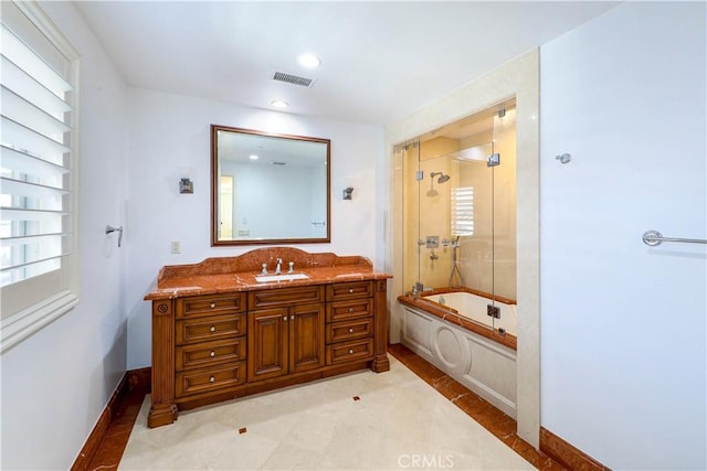 bathroom featuring vanity and enclosed tub / shower combo