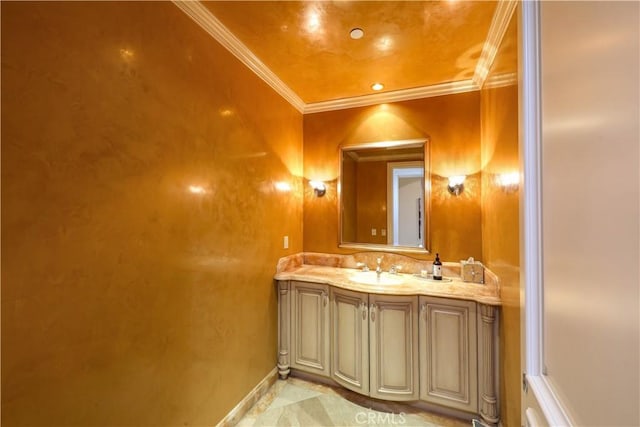 bathroom featuring crown molding and vanity