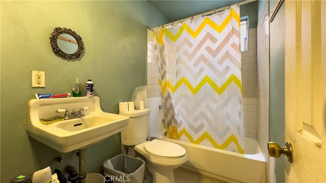 bathroom featuring shower / bath combo, toilet, and tile flooring