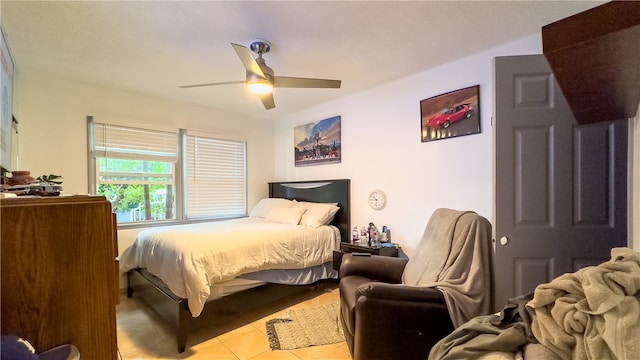 tiled bedroom with ceiling fan