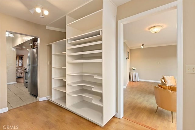 walk in closet featuring light wood-type flooring