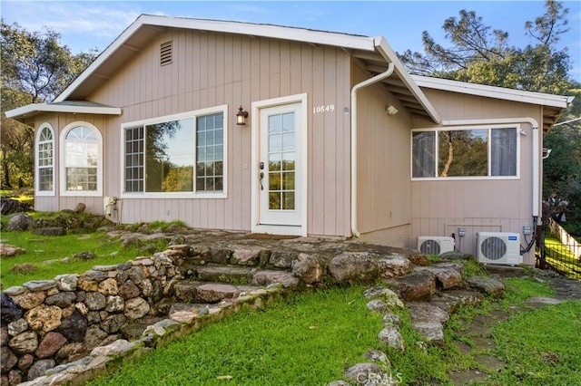 view of home's exterior with ac unit