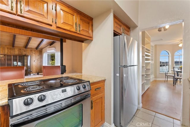 kitchen with stainless steel appliances, ceiling fan, light tile patterned floors, wooden ceiling, and vaulted ceiling with beams