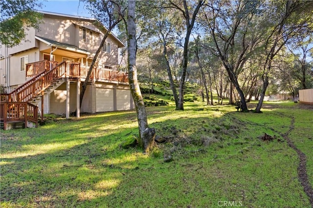 view of yard with a wooden deck